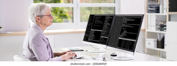 Programmer Woman Coding On Multiple Computer Screens