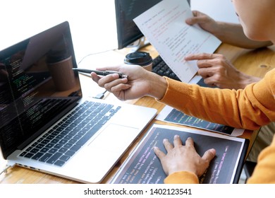 programmer work with Developing programming and coding technologies.  Programmer working with software on  many computer on the table in office. concept Website design