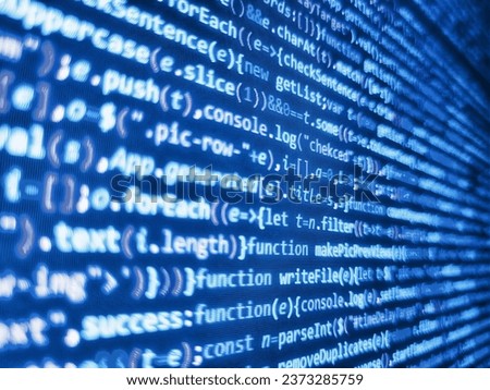Programmer working in desktop laptop. Creative Js HTML5 closeup set on background. Futur. Data bits computer bits, shadow and dark vignette effect