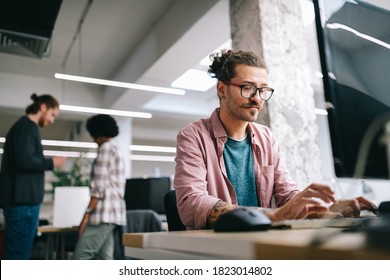 Programmer working and developing software in office - Shutterstock ID 1823014802