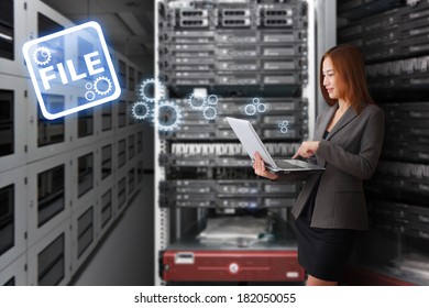 Programmer working with laptop in server room - Powered by Shutterstock - Get 15% off with code: PIKWIZARD15