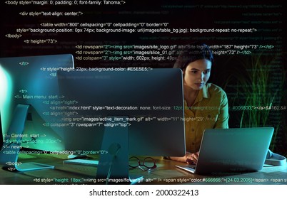 Programmer working in modern office at night
