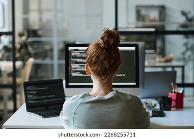 Programmer working on computer in IT office - Powered by Shutterstock - Get 15% off with code: PIKWIZARD15