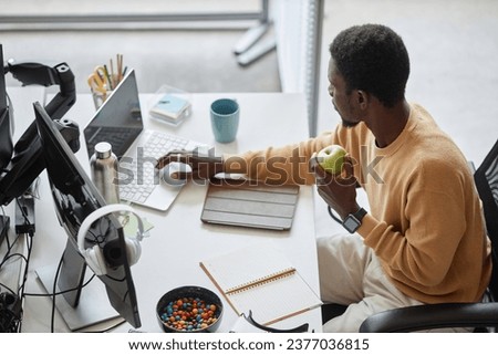 Programmer working on computer in IT office