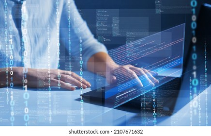Programmer working on javascript computer code with virtual screen. Programming code technology.	
Software apps developer and IT revolution.Digital software development. 