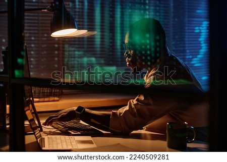 Programmer working overtime in office