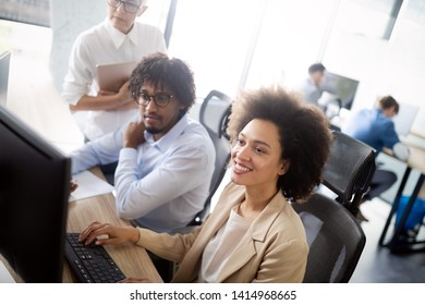 Programmer working in a software developing company office - Shutterstock ID 1414968665