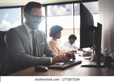 Programmers cooperating brainstorming at information technology company - Shutterstock ID 1771871534