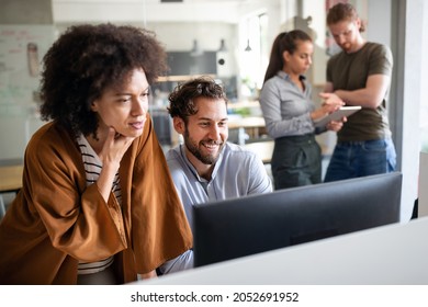 Programmers cooperating brainstorming at information technology company