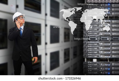 Programmers in data center room and world map  