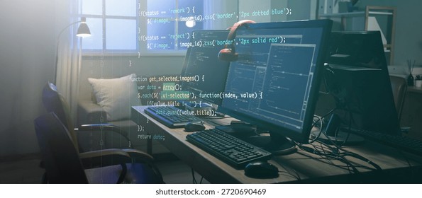 Programmer's desk with computer monitors in dark office at night