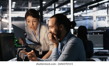 Programmers doing brainstorming in server room, reviewing neural network code and LLM visualization dashboards. Data center coworkers monitoring artificial intelligence systems performance, camera A