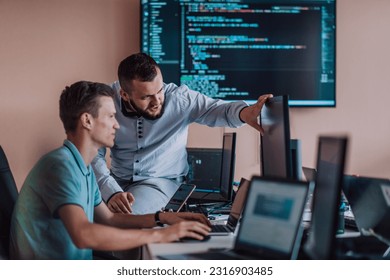 Programmers engrossed in deep collaboration, diligently working together to solve complex problems and develop innovative mobile applications with seamless functionality. - Powered by Shutterstock