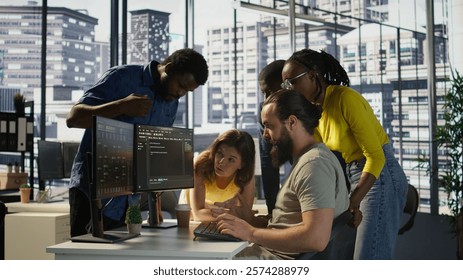 Programmers gathered together to conduct code review to fix errors, identifying technical issues with company software. Team of developers doing brainstorming, optimizing code, camera B