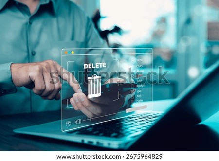 The programmer's hand is tapping on the file icon under the concept of data deletion. The concept  technology and document management.data deletion and removal