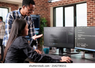 Programmers questioning source of cyber attacks and system security coverage. Software technician triangulates hacker location by updating safety script codes and data processor sequencer.