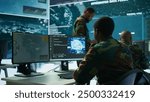 Programming engineer soldier handles AI brain and deep learning data on computer in command post, coordinates national defense operations. Neural network artificial intelligence science. Camera B.