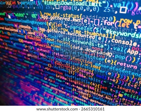 Programming Javascript on laptop computer screen Program code - angle view. Computer programming source code. Closeup of Java Script and HTML code. Software engineer at work. Monitor photo