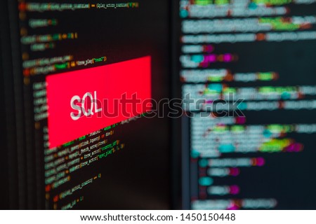 Programming language, SQL inscription on the background of computer code. Modern digital technologies and programming training