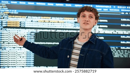 Programming lecture, student and man in university for learning, education or teaching ai course. College, class and study coding with data for software development in digital presentation on screen