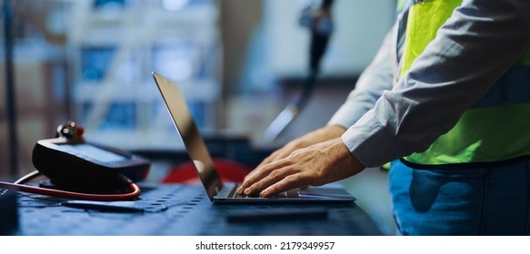Programming robot controller, Programming robotic arms in factory industrial. Robotic arms in production line. Engineer specialist using laptop checking machine in factory. Engineer coding robot. - Shutterstock ID 2179349957