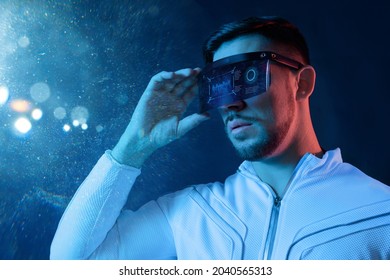 Progress bar loading. Man with futuristic tablet in hand. Guy using VR glasses. Augmented reality, future technology concept. Futuristic holographic loading interface.