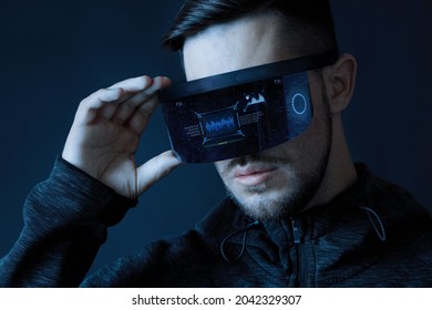 Progress bar loading. Man with futuristic tablet in hand. Guy using VR glasses. Augmented reality, future technology concept. Futuristic holographic loading interface.