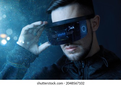 Progress bar loading. Man with futuristic tablet in hand. Guy using VR glasses. Augmented reality, future technology concept. Futuristic holographic loading interface.
