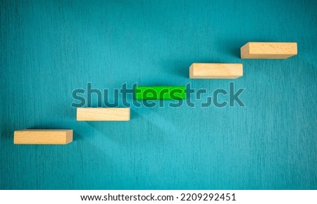 The progress of the project is represented by a photo of the wooden block staircase.