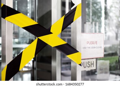 Prohibited Closed Room Due To COVID-19 Or Coronavirus Outbreak. Stay At Home. Black And Yellow Stripes Tapes. Restricted Area Sign. Caution Tape. Closing Office Room. Health Protection And Prevention.