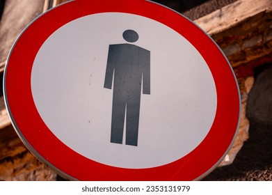 Prohibition of entry to pedestrians, traffic sign. Black figure at red circle frame - Shutterstock ID 2353131979