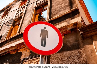 Prohibition of entry to pedestrians, traffic sign. Black figure at red circle frame - Shutterstock ID 2353883775
