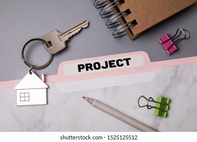 Project. File folder, stationery and home keys on the office desk - Shutterstock ID 1525125512