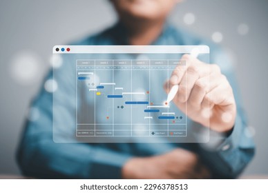Project management or Engineering proceeding concept. Site manager working with Gantt chart schedule for plan tasks and progress. Planning software. Corporate strategy for construction and operations.