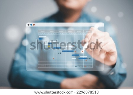 Project management or Engineering proceeding concept. Site manager working with Gantt chart schedule for plan tasks and progress. Planning software. Corporate strategy for construction and operations.