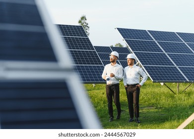 Project manager discuss with worker installation process of solar panel. - Powered by Shutterstock