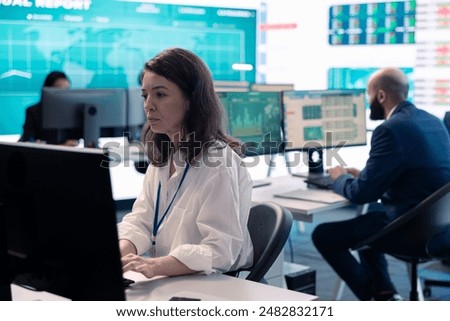 Project manager examining key performance metrics to ensure global business success, working with annual infographics to understand what needs improving. Multinational company activities.