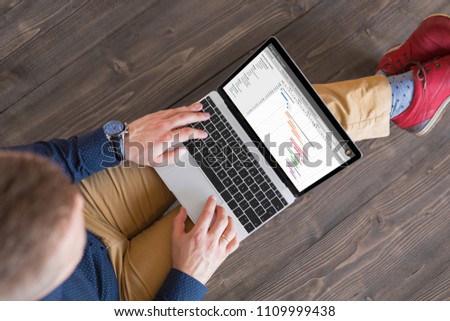 Project manager using laptop computer.