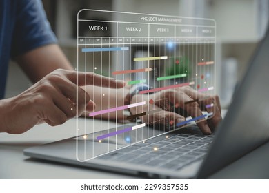 Project manager working with Gantt chart schedule to update the schedule, Management diagram with planning software on laptop screen.