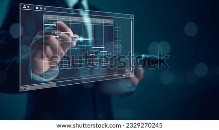 Project manager working with Gantt chart schedule to plan tasks and deliverables. Scheduling activities with a planning software, Corporate strategy for finance, operations, sales, marketing.