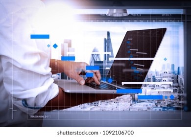 Project Manager Working And Update Tasks With Milestones Progress Planning And Gantt Chart Scheduling Diagram.businessman Working On His Laptop In Office With London City Background,