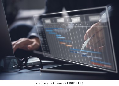 Project manager working and update tasks with milestones progress planning. Businessman using laptop computer and digital tablet with Gantt chart scheduling virtual diagram, project management concept - Shutterstock ID 2139848117