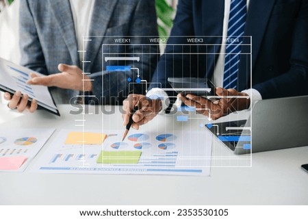 Project manager working and update tasks with milestones progress planning and Gantt chart scheduling diagram.business tram working at modern office
