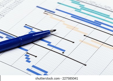 Project plan with pen - Shutterstock ID 227585041