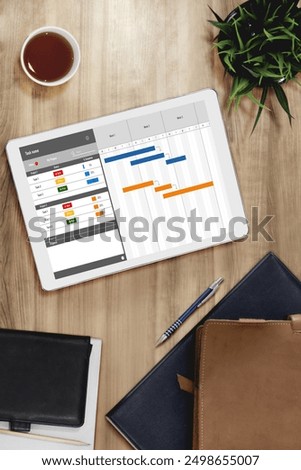 Project planning software for modish business project management on the computer screen showing timeline chart of the team project