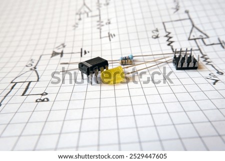 Project with semiconductor components. Integrated circuit and a yellow LED on the electronic circuit diagrams. 