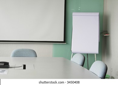 Projection screen in the boardroom with overhead projector in office