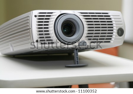 Projector on stand ready for presentation at office