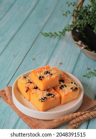 Prol Tape Or Tape Cake, Traditional Snack From Indonesia, Made From Fermented Cassava, Eggs, Sugar And Flower, Sprinkle With Shredded Cheese And Raisin.