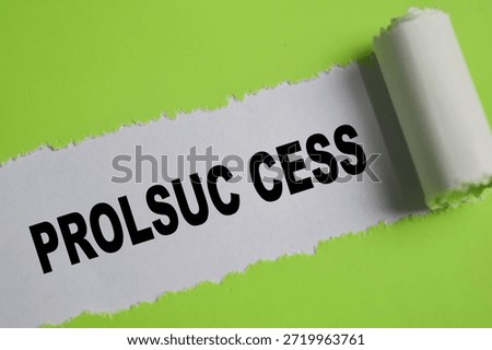 Prolsuc cess text written in torn paper